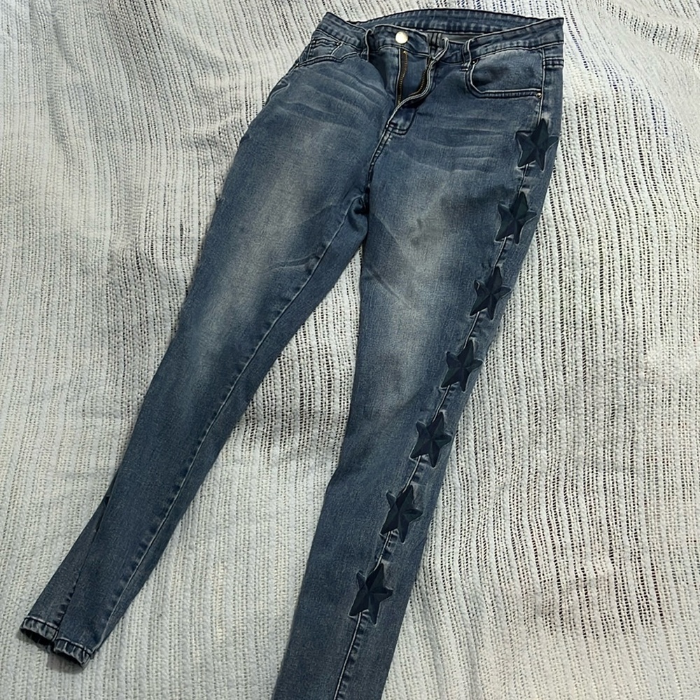 Skinny jeans with stars down the side